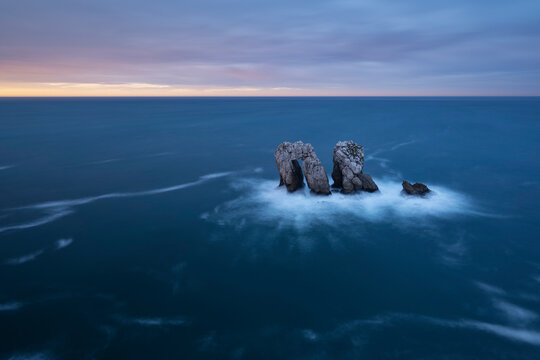 Urro del Manzano rock formation at sunset, Liencres, Spain