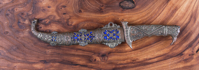 turkish dagger on wooden background