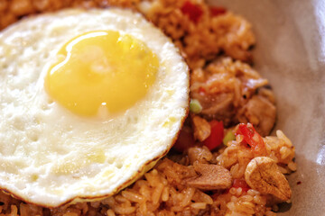 Authentic asian union fried rice and fried egg in a plate.