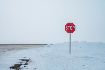 stop sign on the snow