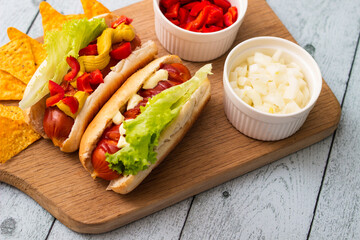 Homemade hot dogs with chilli pepper and other toppings