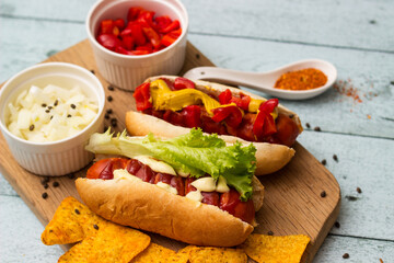 Homemade hot dogs with chilli pepper and other toppings