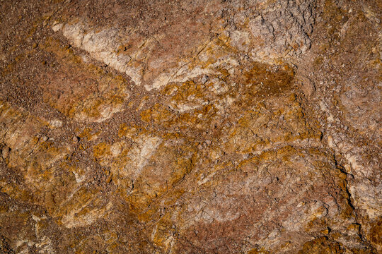 Hard rock wall textured background that has a vintage rusty old grunge effect perfect for an abstract use in the back of other image elements.