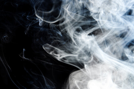 Illuminated smoke with dark background