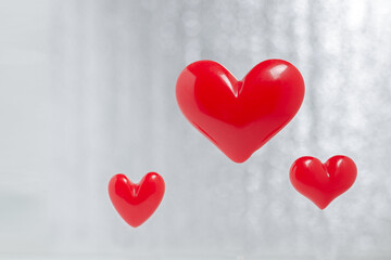 red hearts on a blurry background