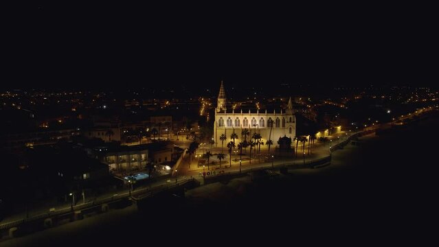 Sky view of Chipiona flying a drone, in the province of Cadiz at night (Andalucia, Spain). View of the Shrine of Our Lady of Regla