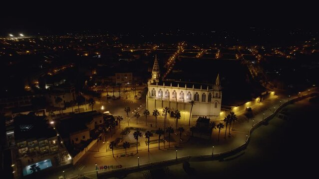 Sky view of Chipiona flying a drone, in the province of Cadiz at night (Andalucia, Spain). View of the Shrine of Our Lady of Regla