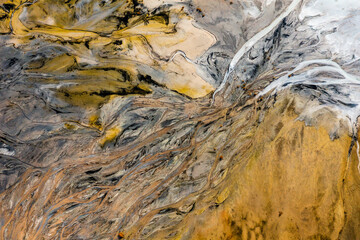 Aerial view of the famous red mud disaster site, abstract lines, surreal landscape, icelandic feeling.