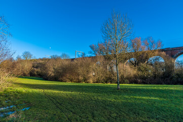 Fototapeta premium A view along the sun drenched side of the Corby Viaduct on the outskirts of Corby, Northampton, UK on a bright winters day