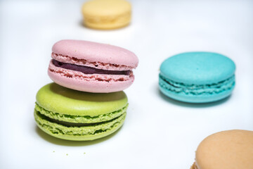 close-up of colorful macaroons on white background