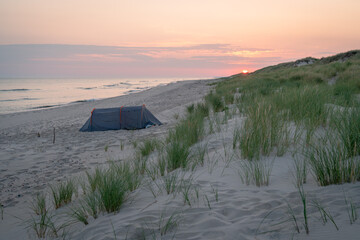Tent on the Baltic  Sea beach on Sunrise 