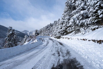 Fototapeta na wymiar Snow covered mountain road