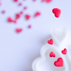 Red hearts on white background.  Large copy space area.  Two overexposed photos (no vector no illustration)