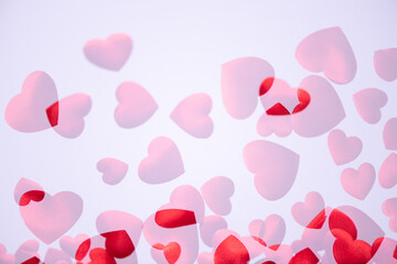 Red hearts on white background.  Large copy space area.  Two overexposed photos (no vector no illustration)
