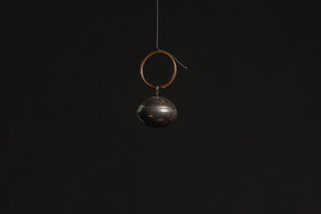 Fototapeta na wymiar Solid brass or bronze vintage bell on black background