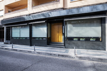 Fototapeta premium Facade of a building with a store at street level