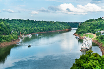 Tourists boat sailing on the Iguazu river seen  seen from the Argentinian side, Iguazu, Brazil,...