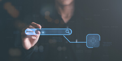 A young man searches for information that interests him through online websites, keyword search...