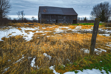 Rural winter landscapes and scenics from Ontario Canada near Kingston Ontario.  Featuring long exposures, farms and old barns with stunning moody skies - 558240187