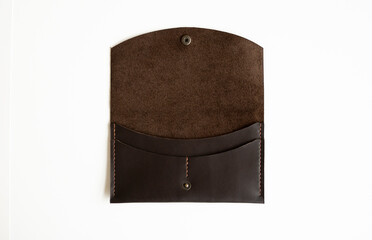 Open brown elegance men's leather wallet on a white background. Mens leather accessories.