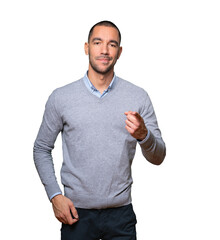 Happy young man pointing at you with his finger