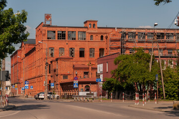 Old abandoned haunted red brick factory of stockings, pantyhose and socks in Central Europe, Poland