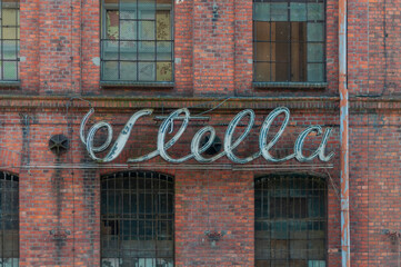 Obraz premium Old abandoned haunted red brick factory of stockings, pantyhose and socks in Central Europe, Poland