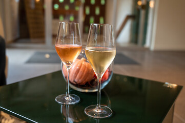 Tasting of brut and rose champagne sparkling wine produced by traditional method in underground caves in Champagne, France