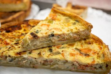 Traditional French quiche vegetable pie with green courgette and carrot