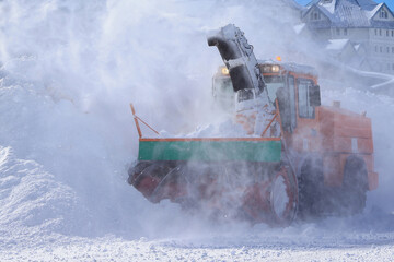 snow thrower, snow removal vehicle, a snowplow is clearing snow from the road. road snow cleaner