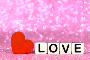 red heart with love message on blur background
