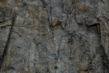 Gray and Brown Texture of Granite Wall In Shadow