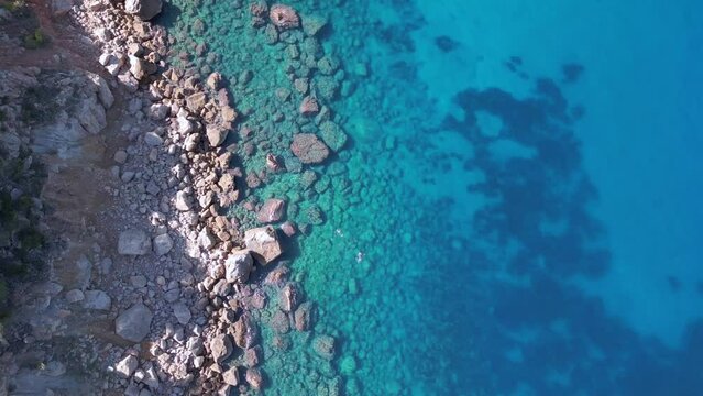 speed ramp Swimming in blue lagoon Dramatic aerial view flight drone of ibiza 