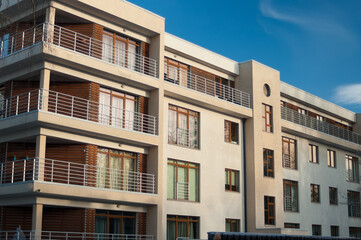 the facade of a new modern house , in the photo balconies and windows of the building close-up