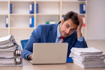 Young male employee working in the office