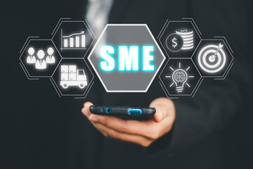 SME, Small and medium-sized enterprises, Business woman using smart phone with SME icon on virtual screen, Business model, KEY TO SUCCESS concept