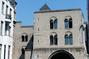 Fototapeta na wymiar old houses and historic gate castle in cologne's eigelstein quarter