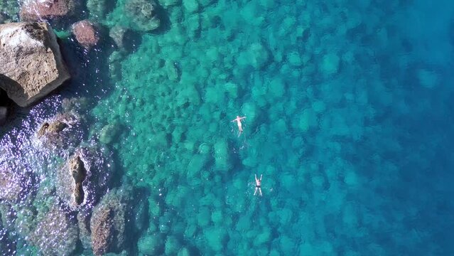 Swimming in blue lagoon Stunning aerial view flight drone of ibiza Aubarca bay