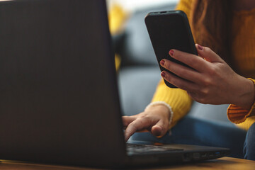woman's hand holding a mobile phone