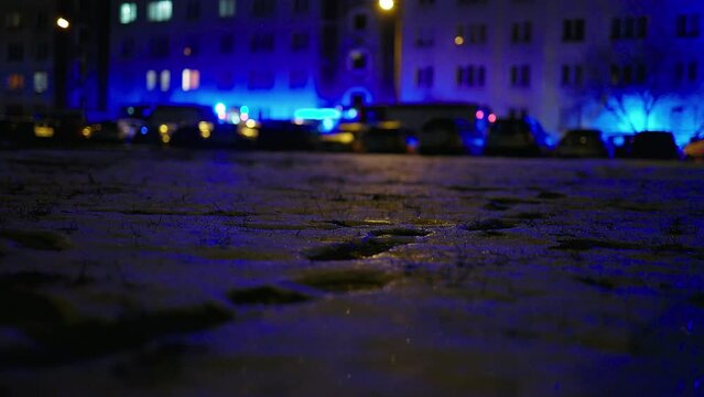 Defocused and abstract: Firefighter truck and ambulance scene with flashing emergency siren at night