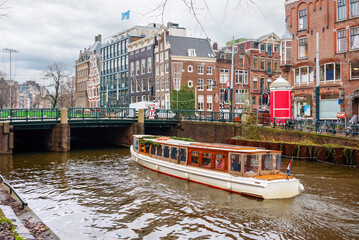 Channel in Amsterdam Netherlands houses river Amstel landmark old european city landscape