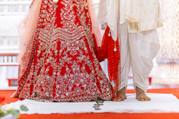 Indian Hindu wedding bride and groom's feet close up
