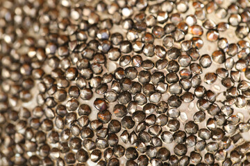  metallic grainy texture in dusty beige colors.metallic shiny texture.Beautiful background in bronze tones