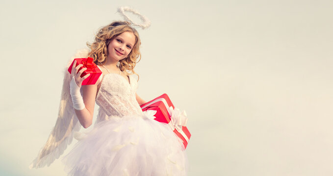 Banner with angel teenager. Teenager Cupid angel with gift. Cute teen Cupid angel with gift on the cloud - sky background. Portrait of a Cupid angel with gift little girl.