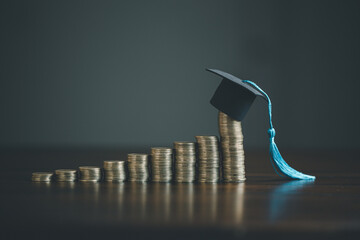 Saving money coin with banking investment, finance education concept. Planning student loan for studying abroad for college or university degree. Future children's education fund cash. Growing saving