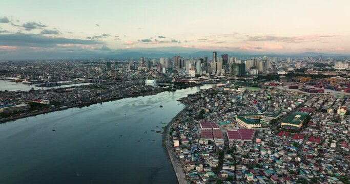 Aerial view of city of Manila with skyscrapers and business buildings at dusk. Philippines