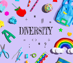 Diversity theme with school supplies on a purple background - flat lay