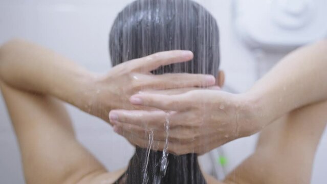 Woman bathing and washing her hair relaxed.	
