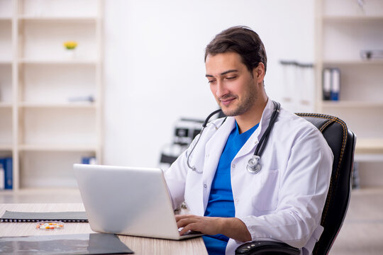 Young male doctor in telemedicine concept