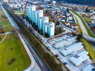 Residential area with hi-rise apartment buildings and the city skyline somewhere in Slovenia
